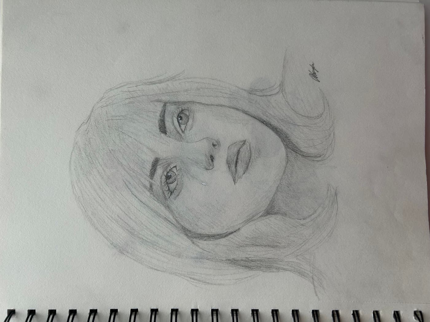 Sketchbook study of a woman's face with long hair and bangs.