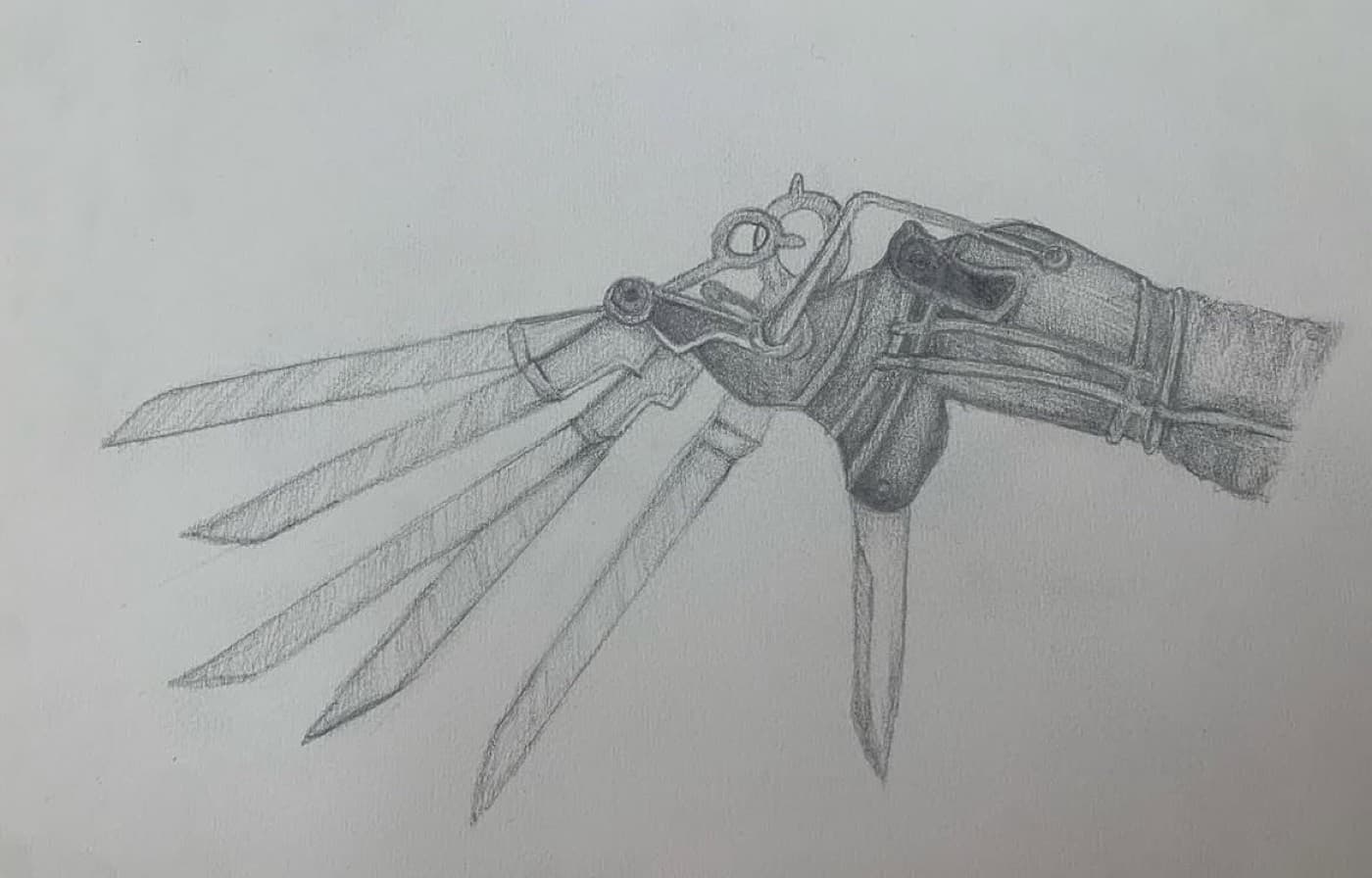 Pencil study of Edward Scissorhands' bladed mechanical hand.